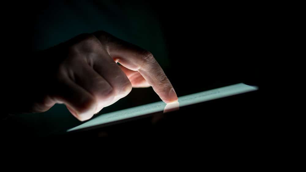 hand touching screen