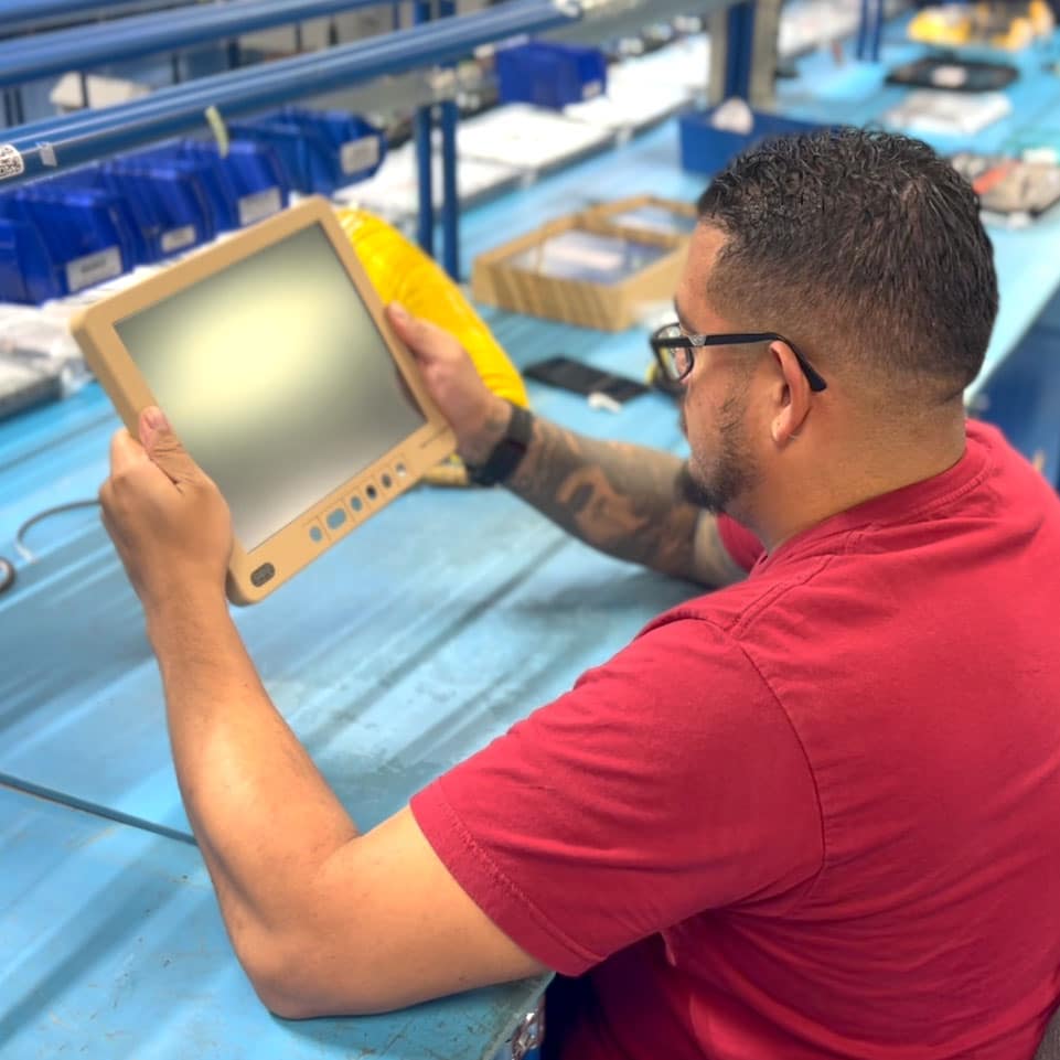 technician examining rugged display